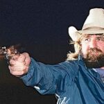 A man firing his pistol