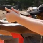 A group of people shooting with pistols