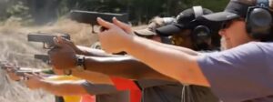 A group of people shooting with pistols