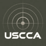 A gray USCCA logo